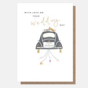 A wedding card. An image of a wedding card with hearts following it and a just married number plate. The card has "With love on your wedding day" printed on the front