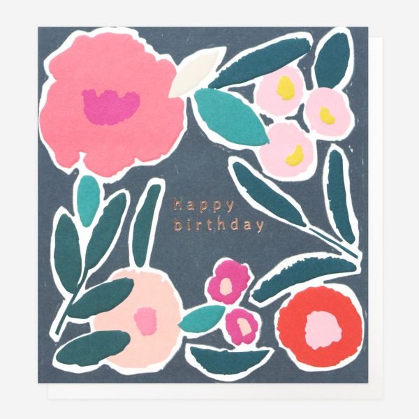 A birthday card with a bright floral design in a painted style on a navy blue background. Happy birthday in rose gold foil