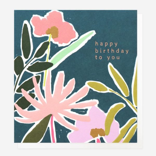 A birthday card with a bright floral design in a painted style on a navy blue background. Happy Birthday To You in rose gold foil