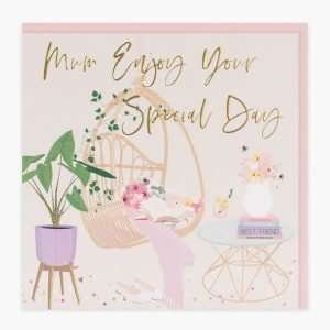 A beautiful luxury Mother's day card with a hanging char and pot plants. In embossed gold the words " Mum enjoy your Special day"