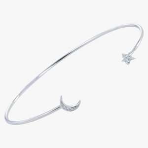 A sterling silver cuff bangle with a lightening bolt on one side of the moon and a star on the other side. Both moon and star are covered in tiny cubic zirconia.