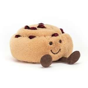 A sweet cuddly amusable pain au raisin with little brown corduroy legs and a smiley face.