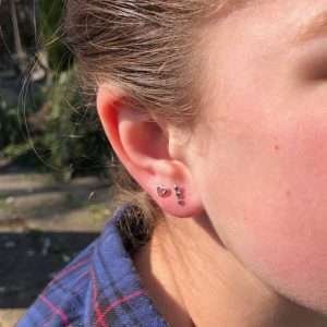 A gorgeous pair of sterling silver triple star stud earrings.