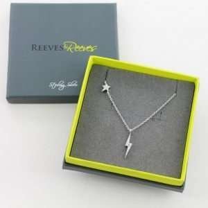 A lovely sterling silver chain link necklace with a lightening pendant which has a star higher up the chain. Bother lightening pendant and the star have a lovely zirconia finish.