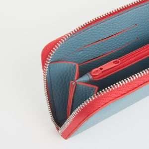 A lovely teal coloured purse with sky red zip and coloured lining