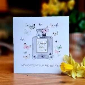 A card from Five Dollar Shake with a perfume bottle labelled Wonderful Mum and butterflies with gem stone flowers. With love to my Mum and best friend