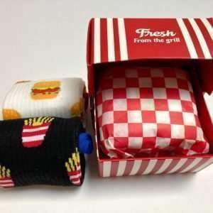 A fun pack of burger themed socks that are presented in a burger box including the wrap paper that burgers come in.