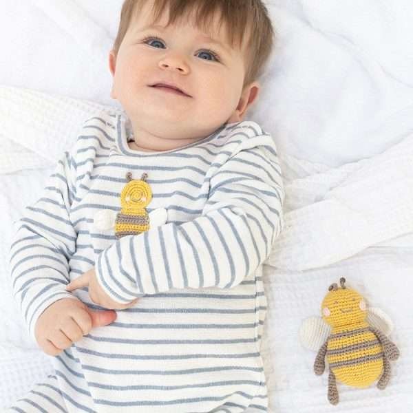 A cotton blue and white stripe baby grow with a crochet bee motif