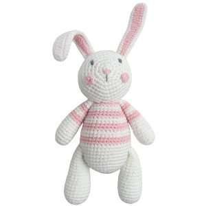 A crochet rabbit toy in white and pink