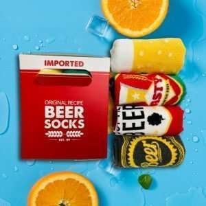 A wonderful gift of four pairs of socks with a beer theme presented in a box to make it look like a pack of four beers