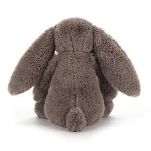 A sweet truffle bunny small from the Bashful range by Jellycat. With mocha coloured fur and a sweet pink nose, truffle bunny has big floppy ears and a cute bobtail.