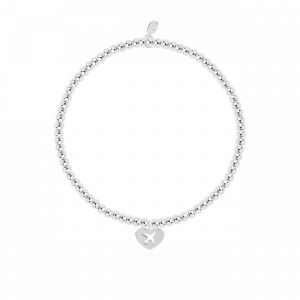 A little life is an adventure bracelet in silver plate with a silver heart charm stamped with an aeroplane. The bracelet is on a white card printed with A little life is an adventure - This little charm is just to say life is an adventure in every way