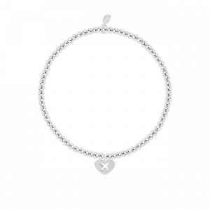 A little life is an adventure bracelet in silver plate with a silver heart charm stamped with an aeroplane. The bracelet is on a white card printed with A little life is an adventure - This little charm is just to say life is an adventure in every way