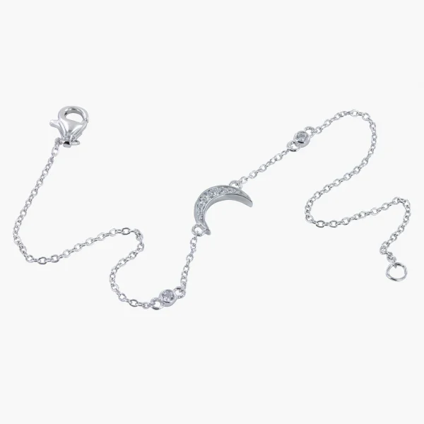 A fine sterling silver chain bracelet with a moon and star, both embellished with a pave stone finish,