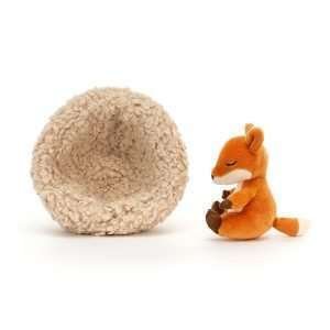 Jellycat Hibernating fox. A little red fox soft toy curled up sleeping in a fluffy nest