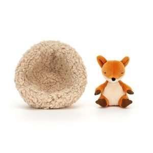 Jellycat Hibernating fox. A little red fox soft toy curled up sleeping in a fluffy nest