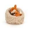 Jellycat Hibernating fox. A little red fox soft toy curled up sleeping in a fluffy nest