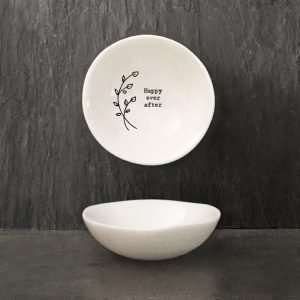 A gorgeous trinket bowl made from porcelain, with a flower design and the words Happy Ever After on it.