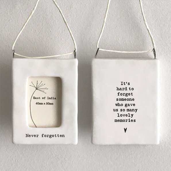 A gorgeous Never Forgotten Mini hanging frame from the ceramic range by East of India. The frame has Never Forgotten written on the front, and with 'Its hard to forget someone who gave us so many lovely memories' on the back,