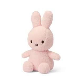 A gorgeous light pink coloured terry miffy bunny. With cute ears and paws and with black eyes and criss cross nose.