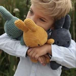 Corduroy Miffy Soft Toys being cuddled by a child