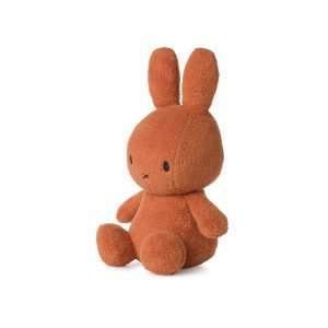 A gorgeous retro orange coloured terry miffy bunny. With cute ears and paws and with black eyes and criss cross nose.