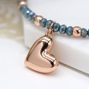 Rose gold round bead and blue faceted bead bracelet with a rose gold style heart charm