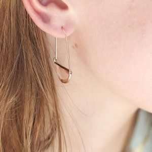 Rose Crystal Earrings. Golden wire elegant pendulum drop earrings with rose pink faceted crystal half moons encased in matching golden settings