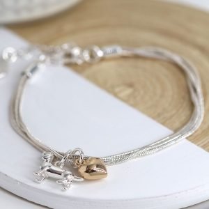 Silver plated triple strand snake chain bracelet with a golden heart charm and silver plated dachshund