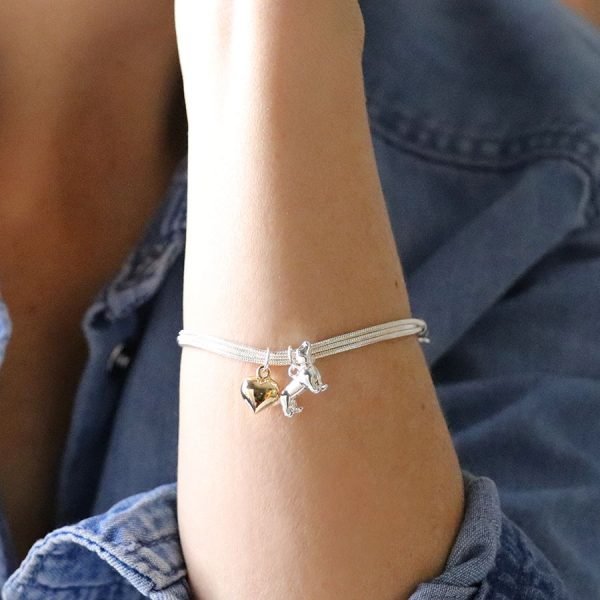 Silver plated triple strand snake chain bracelet with a golden heart charm and silver plated dachshund