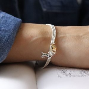 Silver plated triple strand snake chain bracelet with a golden heart charm and silver plated dachshund