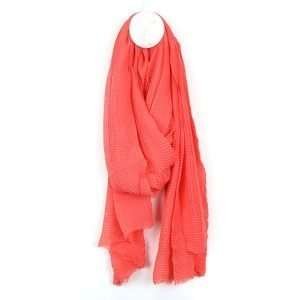 Coral Lightweight Crinkle Scarf. Lightweight scarf in coral pink with a fine pleated texture and lightly frayed ends.
