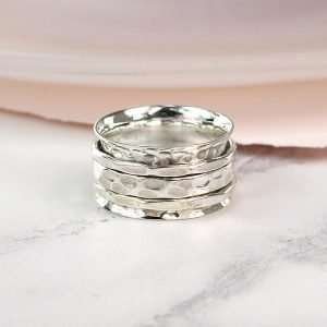 Hand crafted spinning ring made from fine quality beaten sterling silver with three moving bands
