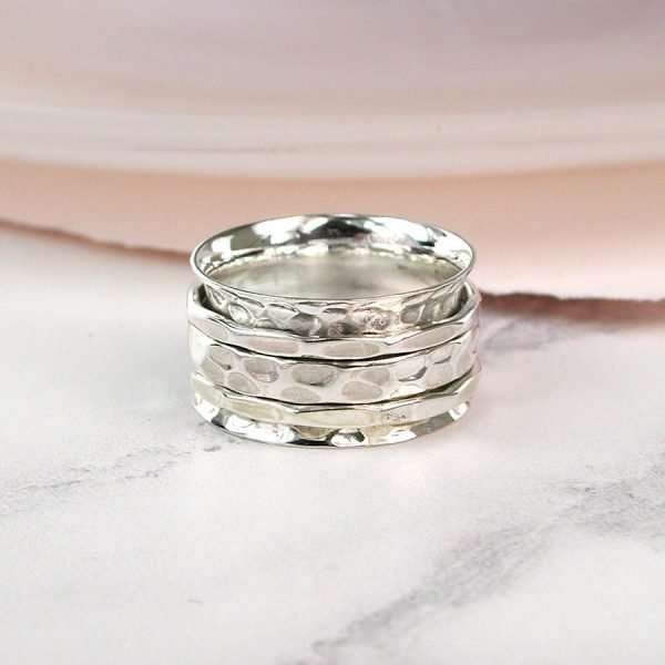 Hand crafted spinning ring made from fine quality beaten sterling silver with three moving bands