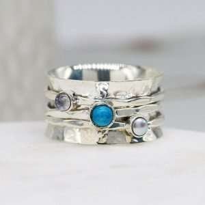 Sterling silver spinning ring with a hammered band, Pearl, Moonstone and Turquoise gemstones