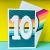 Bright boy's 10th Birthday Card. A bright blue card with embossing a rainbow stripe and a large 10