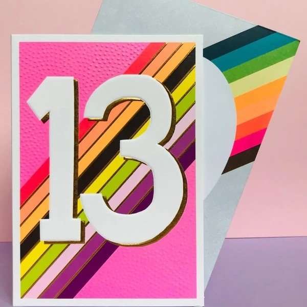 Bright Girl's 13th Birthday Card. A bright pink card with embossing a rainbow stripe and a large 13