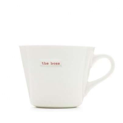 A plain white ceramic mug with the words The Boss printed on the front of it.