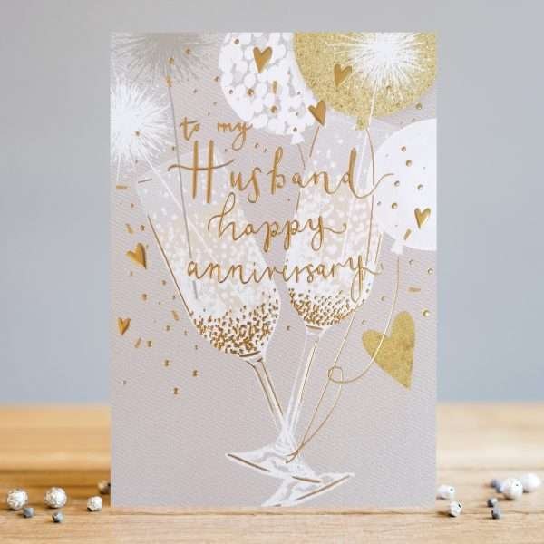 A husband anniversary card with a beautiful glasses and balloons gold design