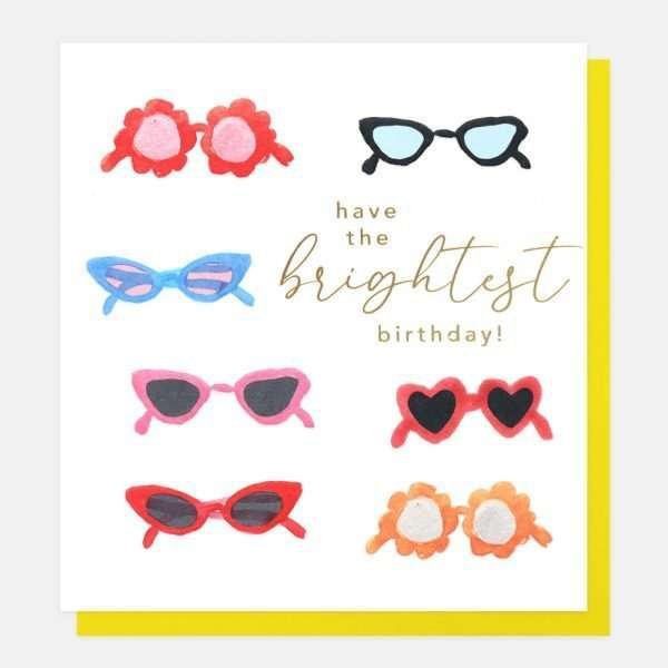 A Caroline Gardner birthday card with lots of sunglasses in a painted watercolour style. Have the brightest birthday