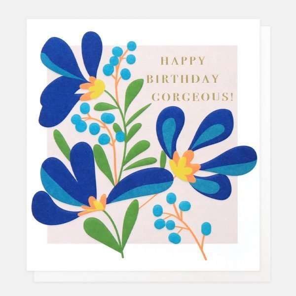 A birthday card with a lilac background and a contemporary blue floral design and happy birthday gorgeous in gold foil lettering