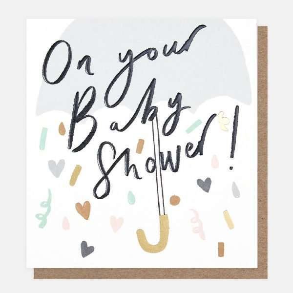 A baby shower card from Caroline Gardner with an umberella and confetti.