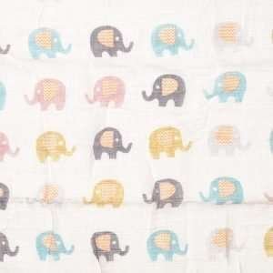 A cotton swaddle blanket with an elephant design with lots of cute colourful elephants