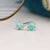 Sterling silver round stud earrings with aqua synthetic opal centres and decorative silver bead edges