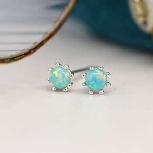 Sterling silver round stud earrings with aqua synthetic opal centres and decorative silver bead edges