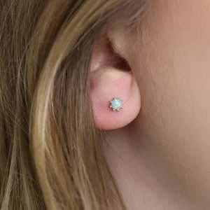 Sterling silver round stud earrings with aqua synthetic opal centres and decorative silver bead edges