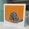 A lovely colourful card with orange background and a pen and ink drawing of Sycamore Gap