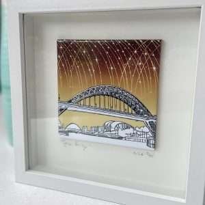 A fantastic Colourful Tyne Bridge tile picture with a pen and ink design and yellow and brown background, set in a box frame.