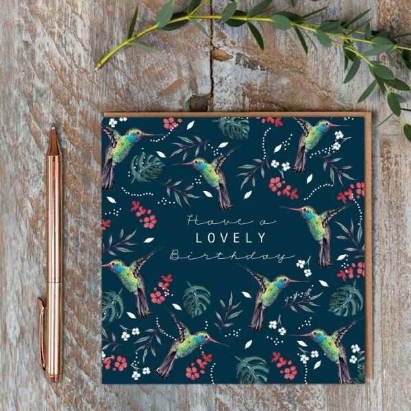 A navy birthday card with hummingbirds