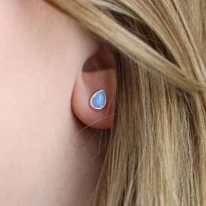 sterling silver teardrop stud earrings set with a striking blue opal